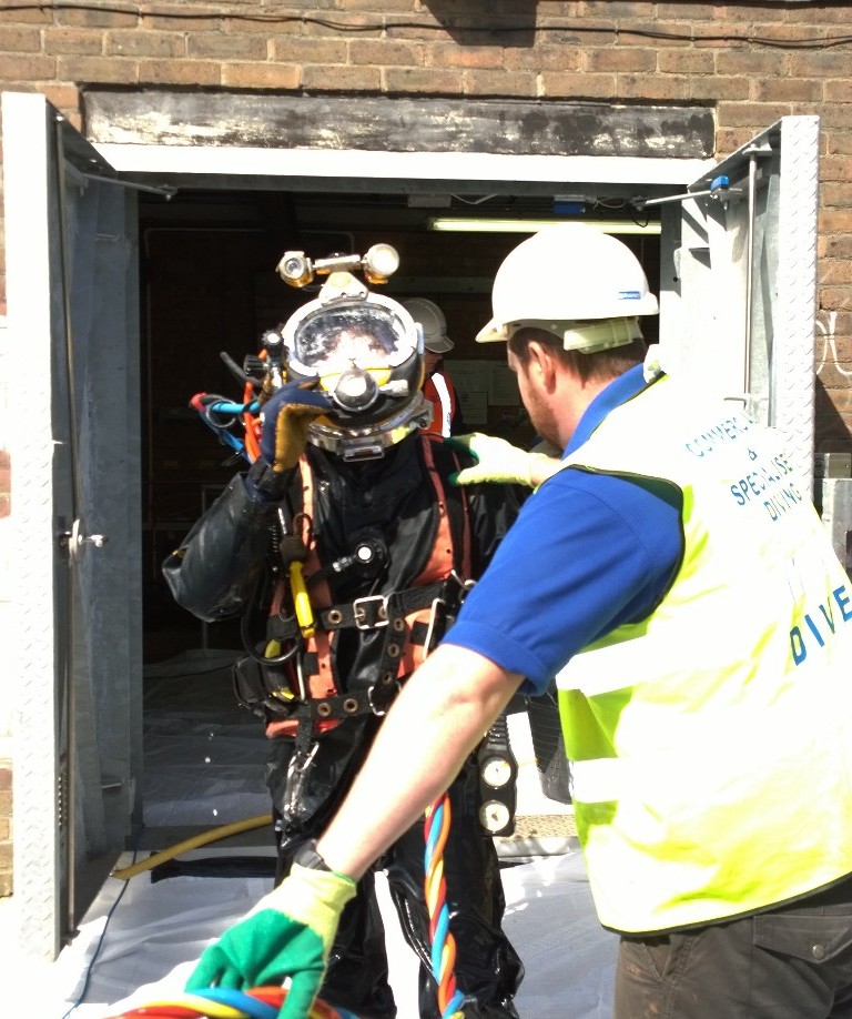 Diver emerging from reservoir